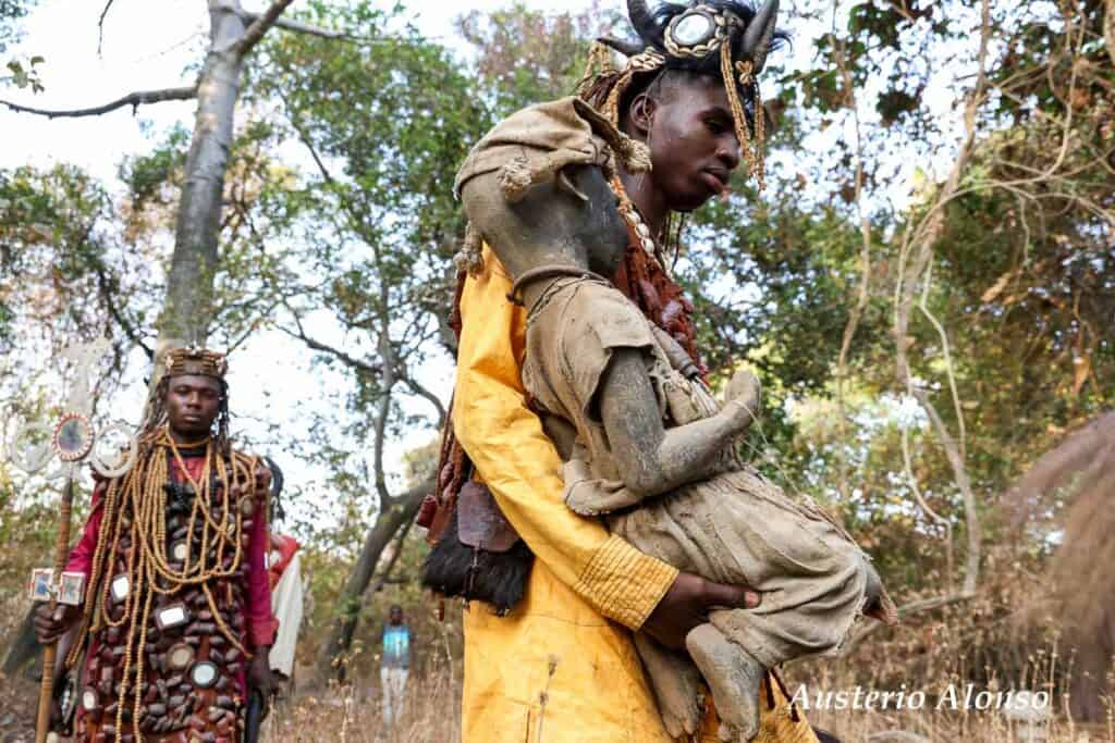 dozo youths in the sacred forest with their fetishes