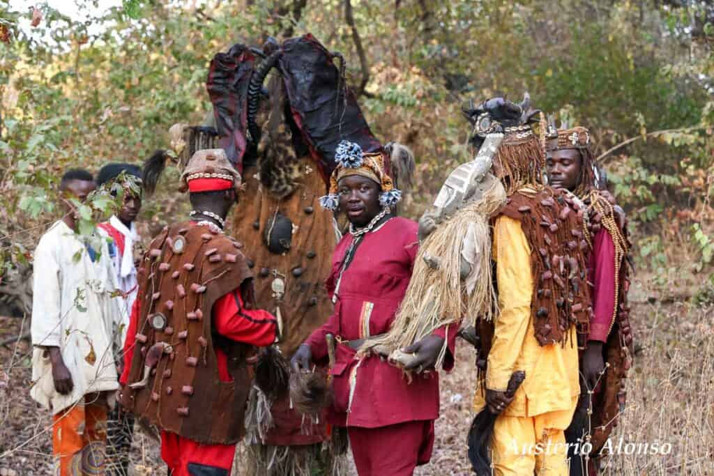 dozo hunters in the sacred forest with a mask and fetishes