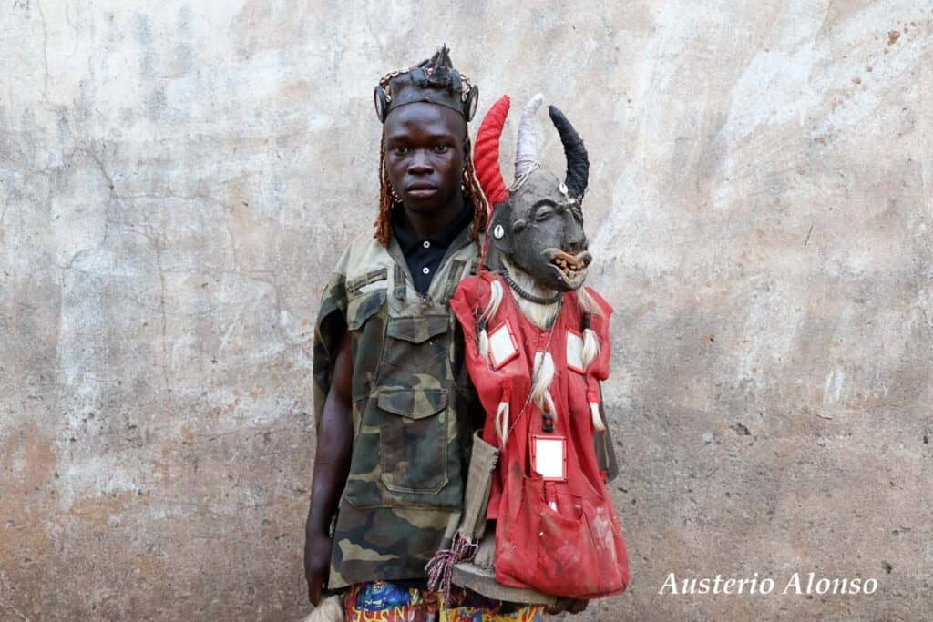 young hunter with a fetish with horns and a red suit with mirrors